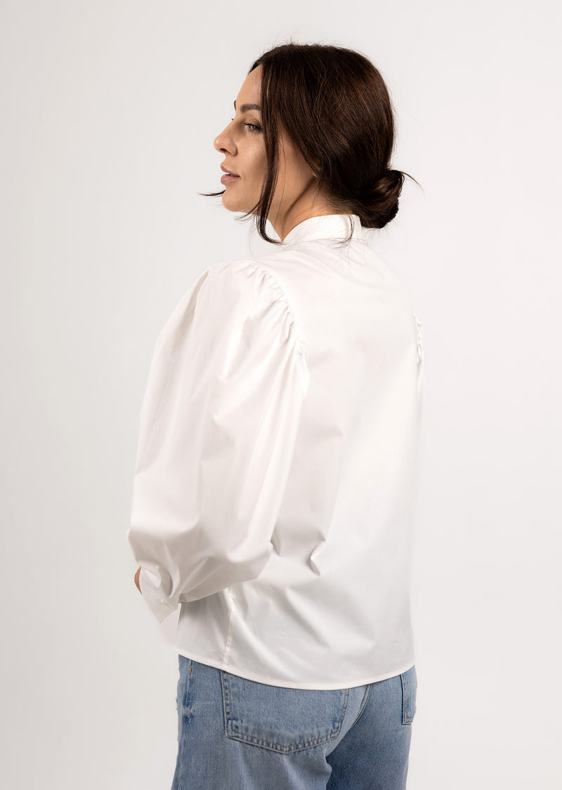 White cotton blouse with volume sleeves