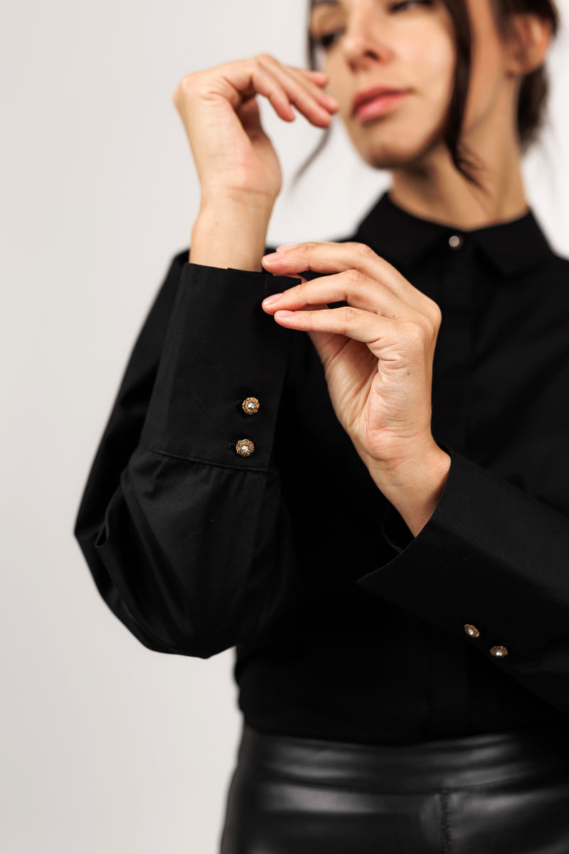 Black cotton blouse with volume sleeves
